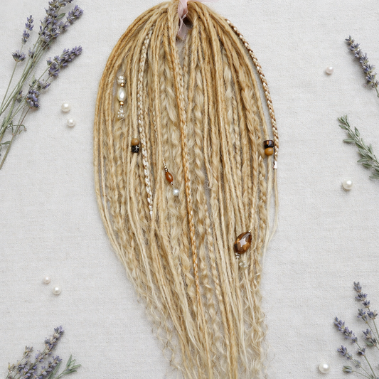 Honey blonde double ended synthetic dreadlocks with loose curls