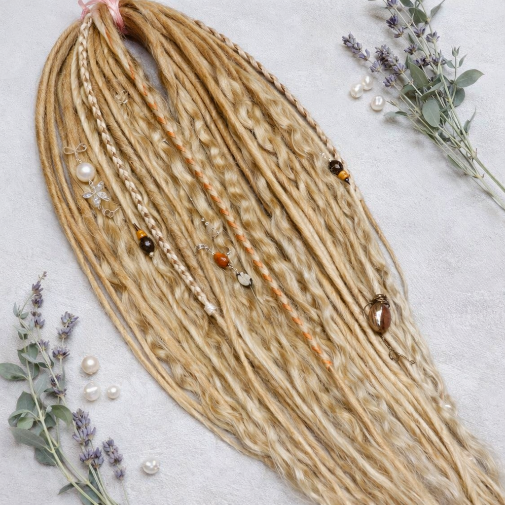 Honey blonde double ended synthetic dreadlocks with loose curls