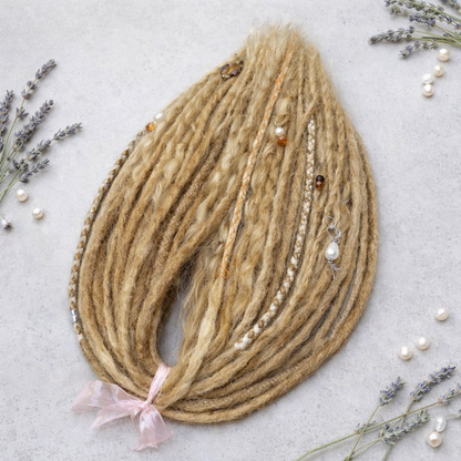 Honey blonde double ended synthetic dreadlocks with loose curls