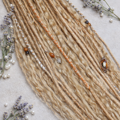 Honey blonde double ended synthetic dreadlocks with loose curls