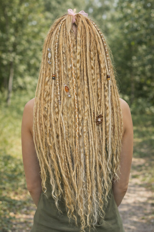 Honey blonde double ended synthetic dreadlocks with loose curls