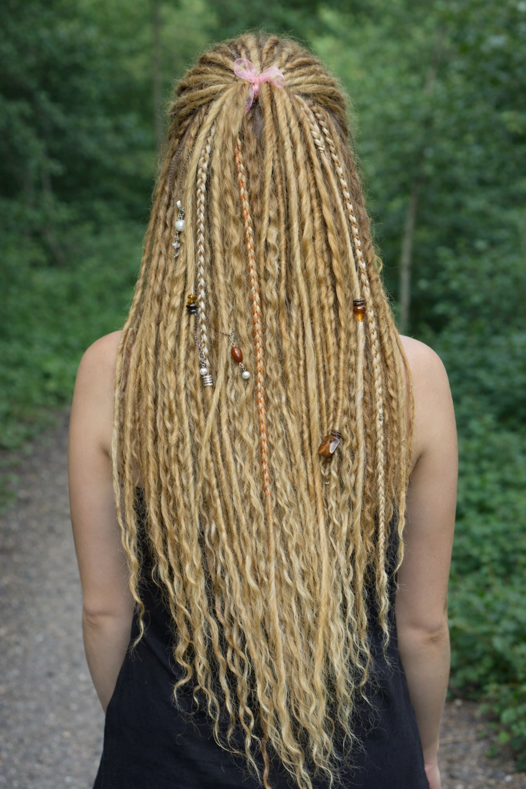 Honey blonde double ended synthetic dreadlocks with loose curls