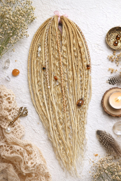 Honey blonde double ended synthetic dreadlocks with loose curls