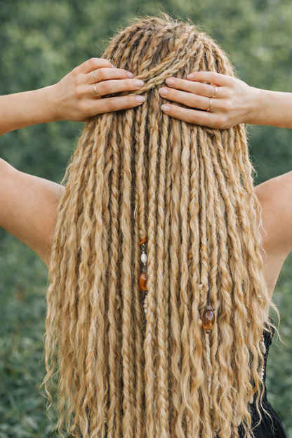 Honey Blonde Dreadlock Extensions with Loose Curls